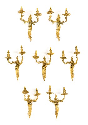 Lot 419 - A Set of Seven Gilt Metal Twin-Light Wall...