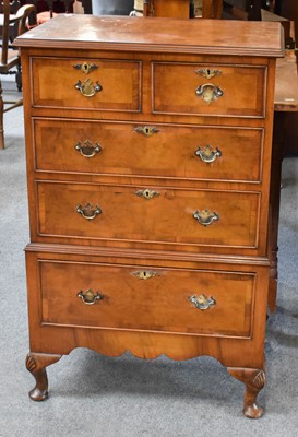 Lot 1143 - A Reproduction Figured Walnut Chest in Stand,...