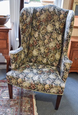 Lot 1319 - A George III Wing Chair, with later floral...