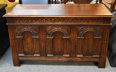 Lot 1162 - A Reproduction Oak Coffer, carved to the front...