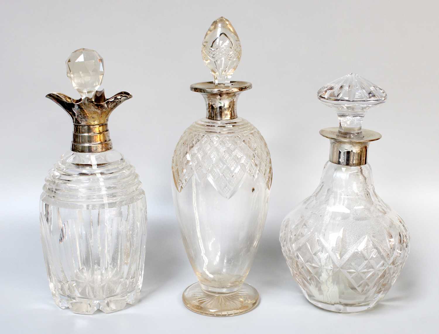Lot 2 - Three Silver Mounted Cut-Glass Decanters, one...
