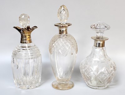 Lot 2 - Three Silver Mounted Cut-Glass Decanters, one...