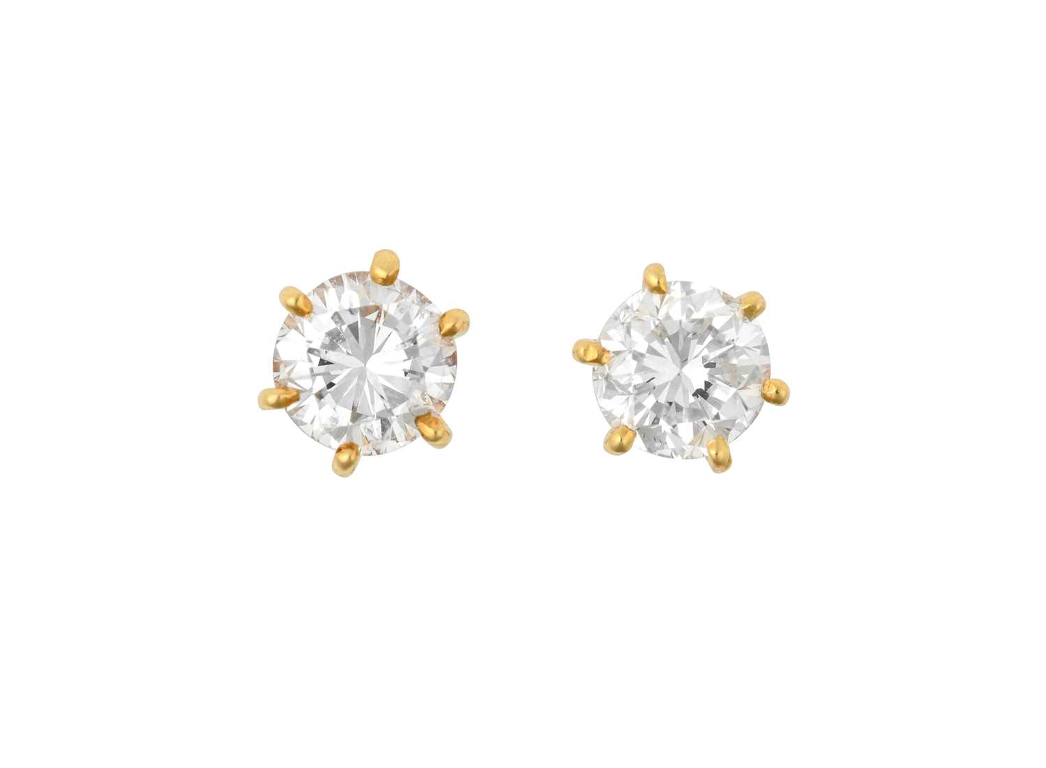 Lot 2036 - A Pair of Diamond Solitaire Earrings the round...