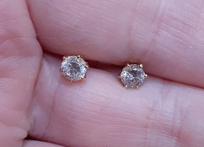 Lot 2036 - A Pair of Diamond Solitaire Earrings the round...