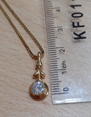 Lot 2014 - A Diamond Solitaire Pendant on Chain the round...