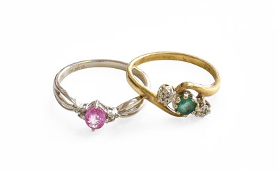 Lot 440 - A Pink Sapphire and Diamond Ring, stamped '14K'...