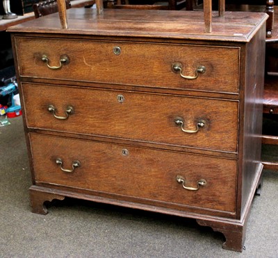 Lot 1390 - A George III Oak Three High Chest of Drawers,...