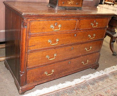 Lot 1421 - A George III Oak Four Height Chest of Drawers,...