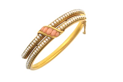 Lot 2139 - A Split Pearl and Coral Hinged Bangle the...