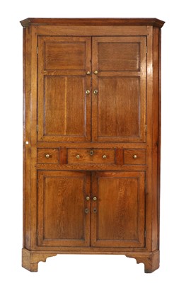 Lot 1116 - A George III Oak Free-Standing Corner Cupboard,...