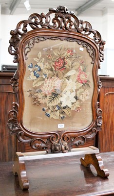 Lot 1201 - A Carved Mahogany Firescreen, with needlework...