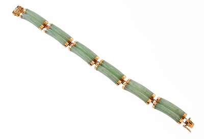 Lot 403 - A Jade Two Row Bracelet, stamped '14k585',...