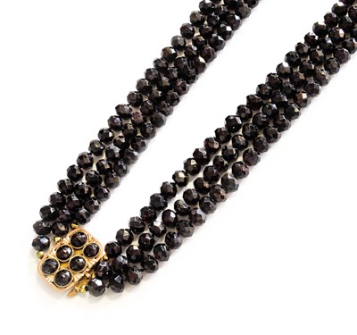 Lot 460 - A Garnet Three Strand Necklace, three strands...