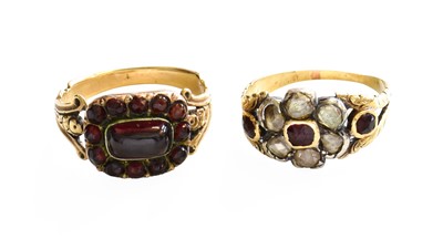 Lot 465 - A Garnet and Diamond Cluster Ring, the central...