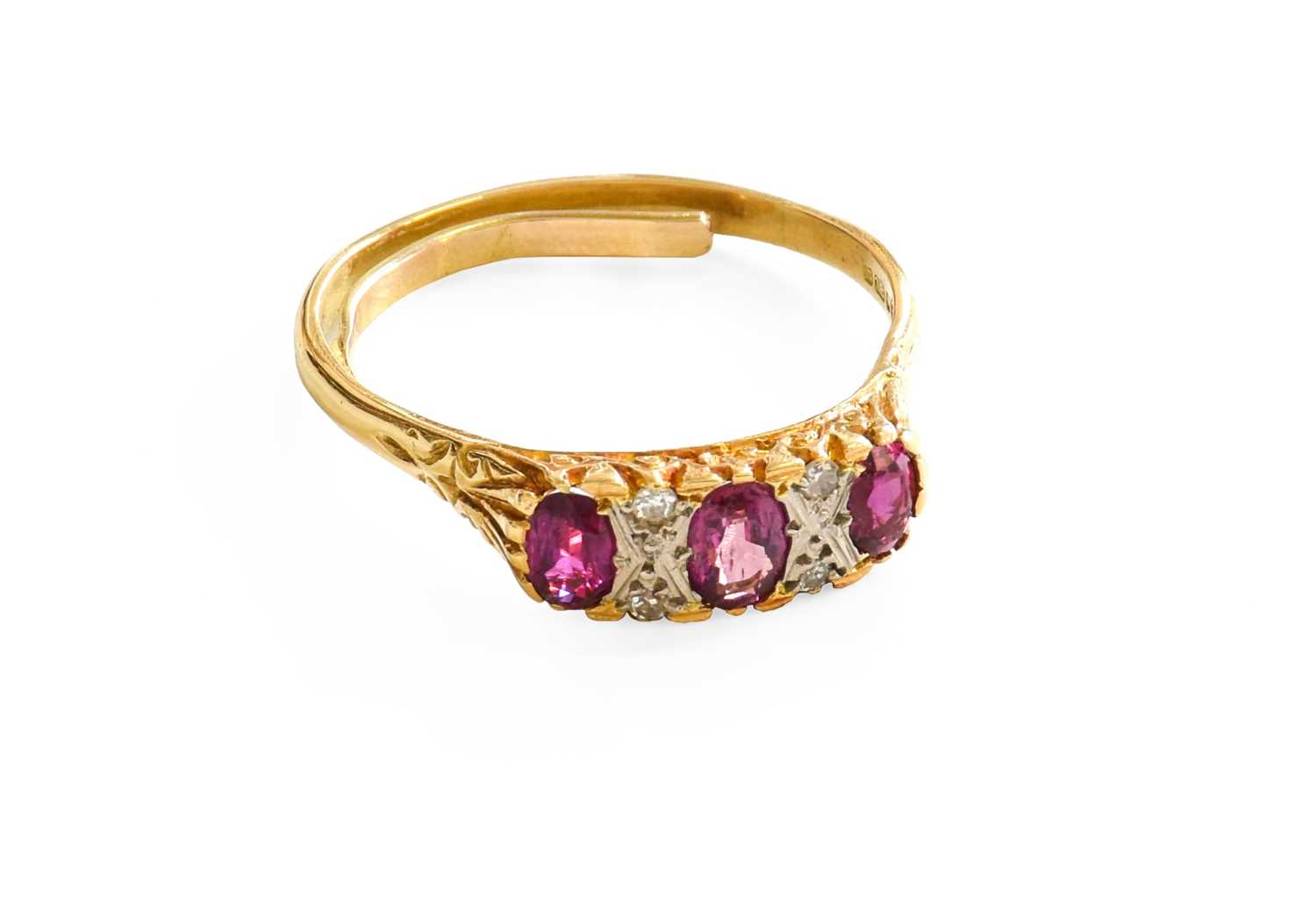 Lot 449 - An 18 Carat Gold Ruby and Diamond Ring, three...