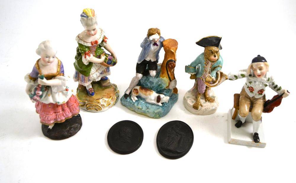 Lot 349 - Five Continental porcelain figures comprising a monkey band figure, a Vienna figure of a girl,...