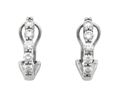 Lot 2067 - A Pair of Diamond Earrings a row of five round...