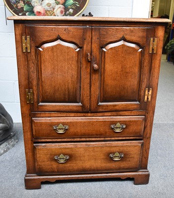 Lot 1177 - A Titchmarsh and Goodwin Style Oak Two Door...