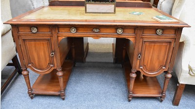 Lot 1307 - An Edwardian Leather-Inset Walnut Desk, 134cm...