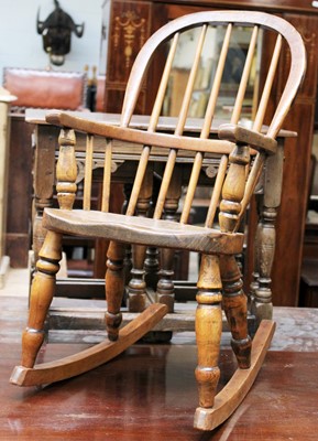 Lot 1414 - A 19th Century Elm Child's Windsor Rocking Chair