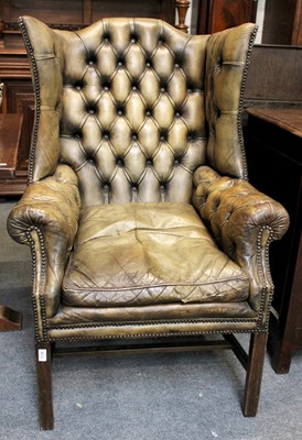 Lot 1138 - A Wing Back Armchair in George III Style,...