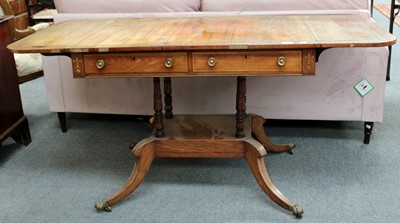 Lot 1297 - ~ A Regency Rosewood Sofa Table, with brass...