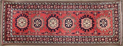 Lot 212 - Afghan Runner, modern The brick red field with...