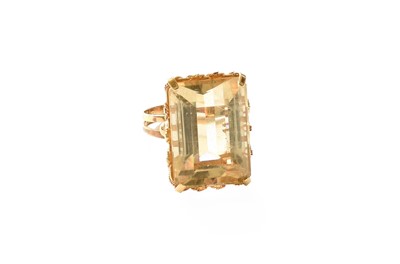 Lot 397 - A Citrine Ring, the emerald-cut citrine in a...