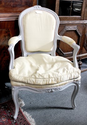 Lot 1313 - ~ A French Carved and Painted Fauteuil, on...