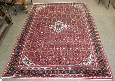 Lot 1241 - A Hosseinabad Carpet, the brick red field...