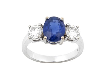 Lot 2316 - A Sapphire and Diamond Three Stone Ring the...