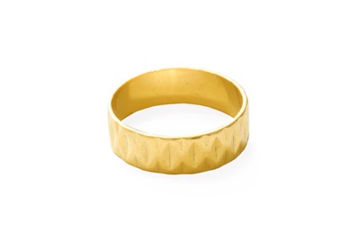 Lot 481 - A Textured 22 Carat Gold Band Ring, finger size V