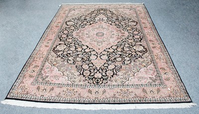 Lot 1254 - Kashmir Silk Piled Carpet, the charcoal field...