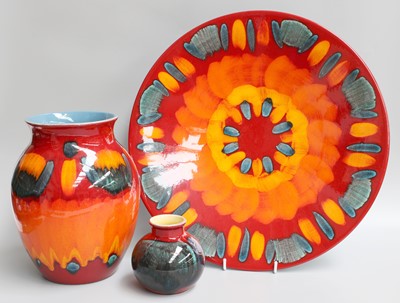 Lot 156 - A Poole Pottery Orange Ground Charger, an...
