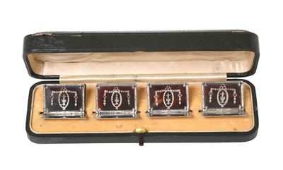 Lot 2345 - A Cased Set of Four George V Silver and Tortoiseshell Place-Card Holders