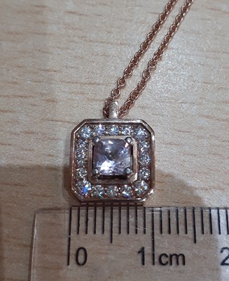 Lot 2070 - A Morganite and Diamond Cluster Pendant on...