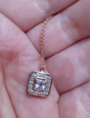 Lot 2070 - A Morganite and Diamond Cluster Pendant on...