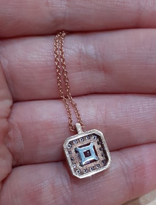 Lot 2070 - A Morganite and Diamond Cluster Pendant on...