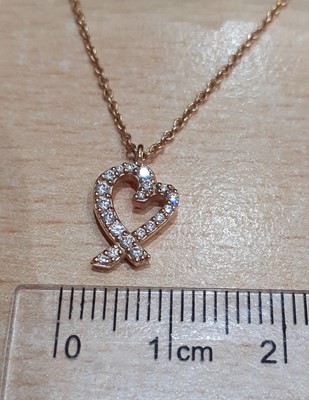 Lot 2002 - A Diamond 'Loving Heart' Pendant on Chain, by...