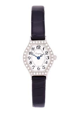 Lot 2438 - Longines: A Lady's Stainless Steel Diamond Set...