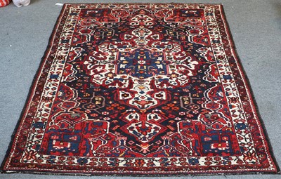 Lot 1100 - Bakhtiar Rug, the midnight blue field of...