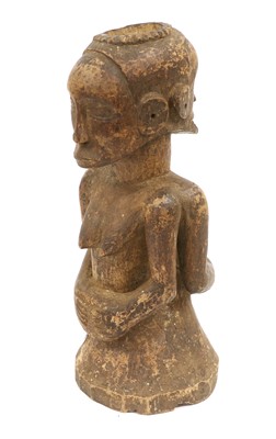 Lot 197 - A Yoruba Carved Wood Ibiji, standing with high...