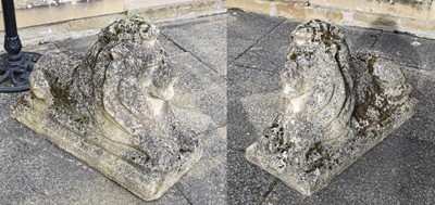 Lot 1292 - A Pair of Reconstituted Stone Recumbent Lions