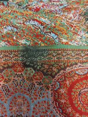 Lot 2089 - A Late 19th Century Woven Red Paisley Shawl in...