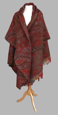 Lot 2089 - A Late 19th Century Woven Red Paisley Shawl in...