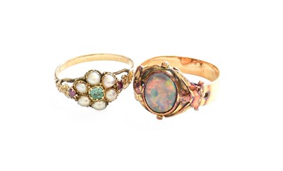 Lot 455 - An Opal Ring, the oval cabochon opal in a...