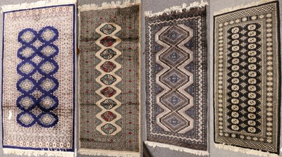 Lot 1255 - Pakistani "Bukhara" Rug, the ivory field with...