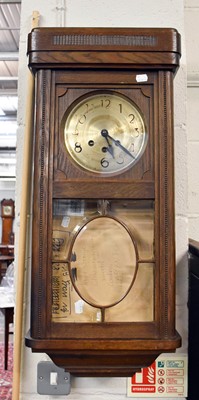 Lot 1286 - A 1920's Oak Cased Chiming Wall Clock, 79cm high