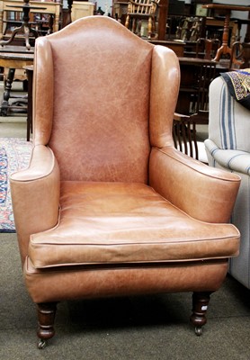 Lot 1425 - An Oak Framed Wingback Armchair, early 20th...