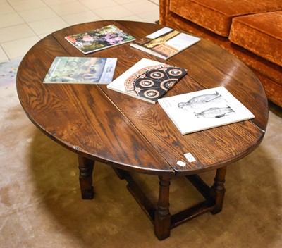 Lot 1526 - An Oak Dropleaf Coffee Table, on turned...